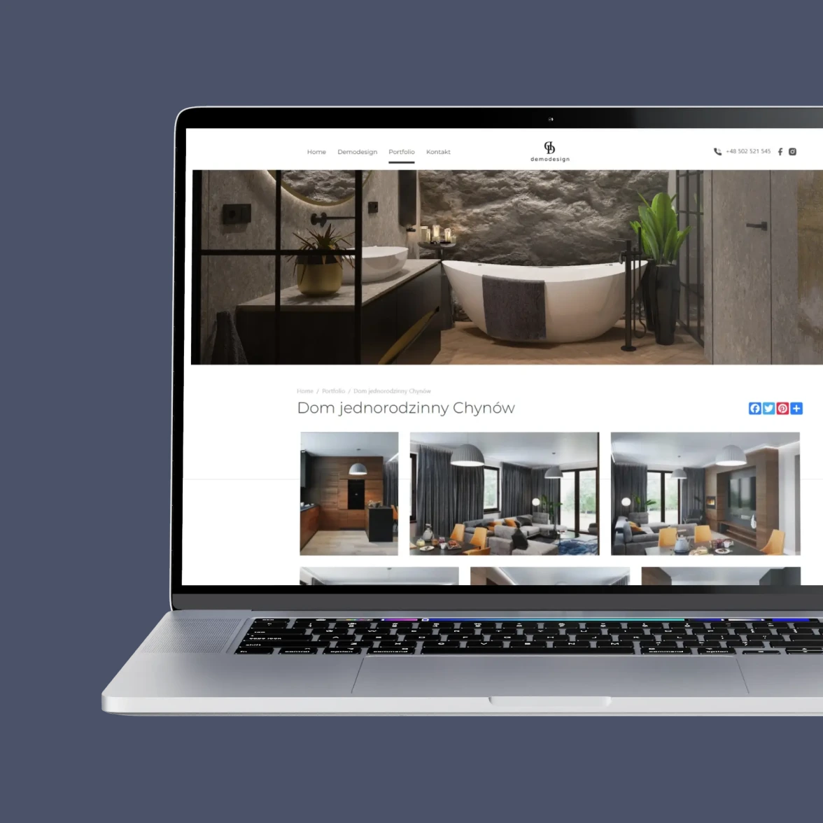 Laptop z wyświetloną stroną internetową demodesign.eu